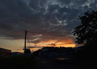 Dramatic Sunset Over Industrial Area