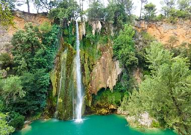 Photography of Waterfall of Sillans la Cascade cascading into turquoise pool in Provence in France