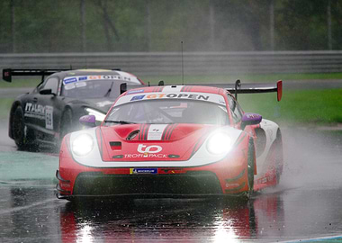 Racing cars in the rain