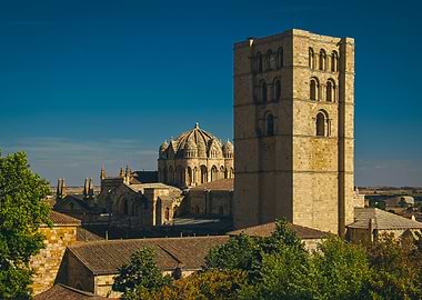 Stone church tower of zamora cathedral viewed from jardines de baltasar lobo park in zamora