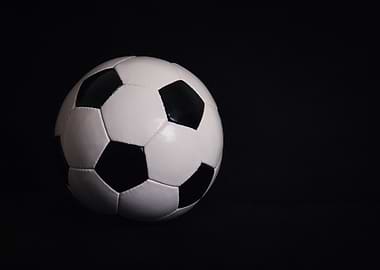 Soccer ball on black background