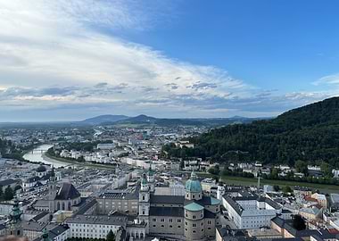 Salzburg Cityscape with River and Mountains