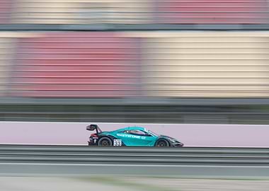 McLaren Race Car Speeding on Track