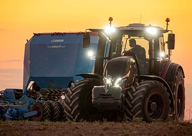 Tractor with Seeder at Sunset