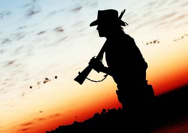 Silhouette of a Cowboy with Rifle