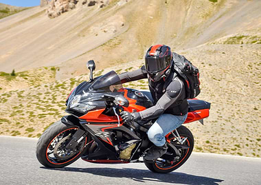Motorcycle rider on mountain road