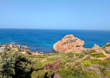 Coastal Landscape with Rocky Outcrop and Blue Sea