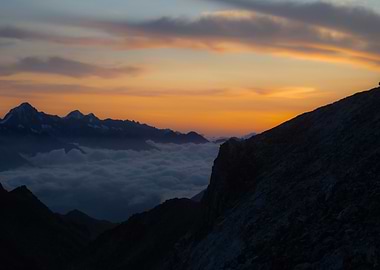 Mountain Sunrise Over Clouds