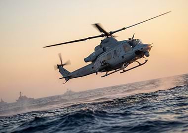 Helicopter flying over the ocean