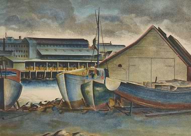 Boats docked at a harbor with a building