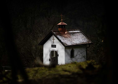 Small chapel in a dark forest