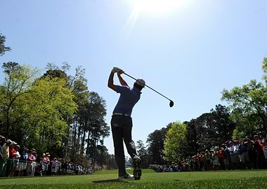 rory mcilroy swings club with crowd watching