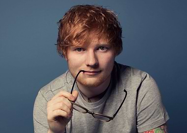 Ed Sheeran holding glasses