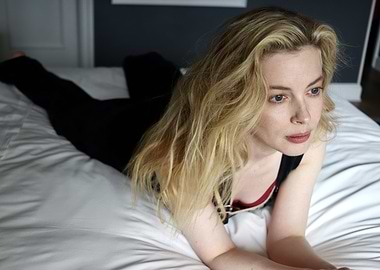 gillian jacobs lying on a bed