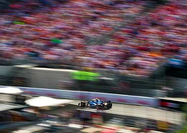 Blue race car speeding on track