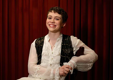 sophia lillis in historical costume smiling