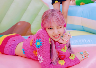 Woman in pink outfit with pink hair jennie