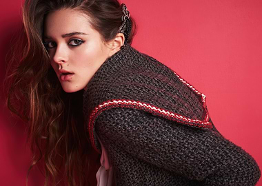 charlotte lawrence in a knitted sweater