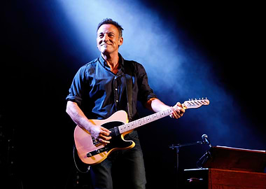 Bruce Springsteen Playing Guitar on Stage
