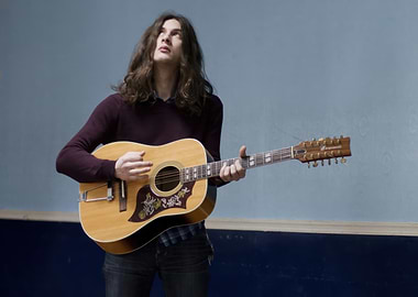kurt vile playing a 12-string guitar