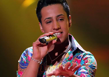 checker boy singing into a microphone