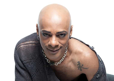 percival bald with Tattoo and Necklace