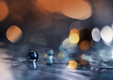 Glass ball on a reflective surface