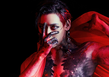 bambam with black paint and red fabric