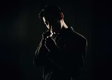 bambam lighting a pipe in silhouette