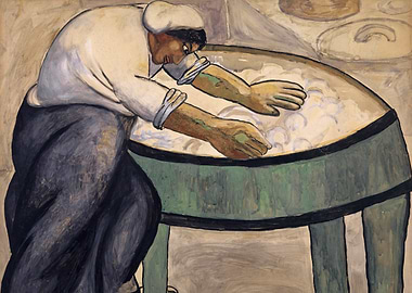 Worker washing clothes in a tub