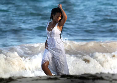 Woman in white dress on beach