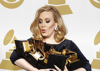 Adele with Grammy Awards
