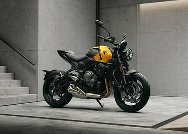 Yellow Triumph Motorcycle in Modern Setting