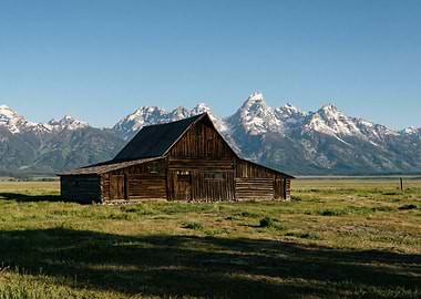 Rustic Barn with Snow-Capped Mountains