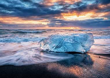 Iceberg on a Black Sand Beach at Sunset