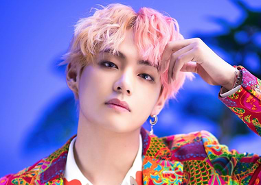 BTS V with pink hair and colorful jacket