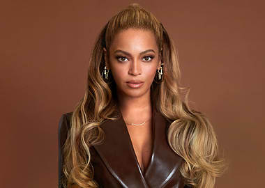 Beyoncé in a brown jacket