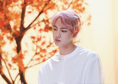 Jin with pink hair and autumn leaves