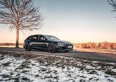 Black Audi RS4 Avant on Snowy Road