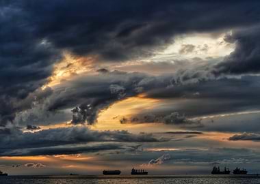 Stormy Sunset Over the Ocean with Ships
