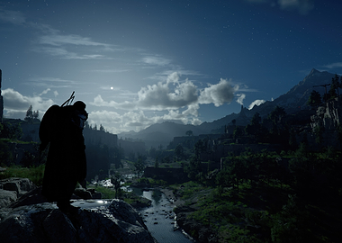 Lone figure overlooking a moonlit valley