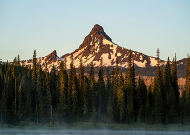 Misty Lake and Snow-Capped Mountain