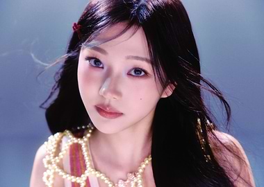 stella babymonster with dark hair and pearl necklace