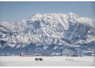 Train in Snowy Mountains