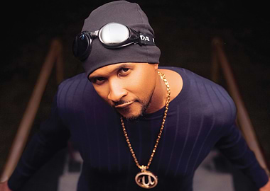 Usher wearing goggles and a beanie