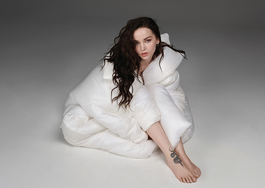 dove cameron wrapped in a white duvet