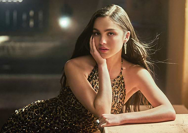 Olivia Rodrigo in a sequined leopard print dress