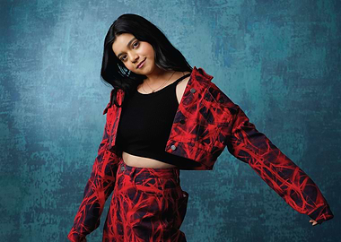 iman vellani in red and black tie-dye outfit