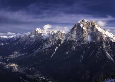 Snow-capped mountains overlooking a town