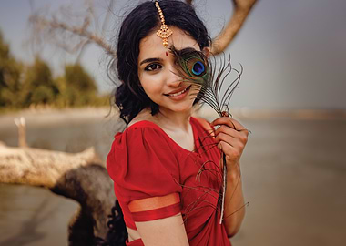 mamitha baiju in Red Saree with Peacock Feather
